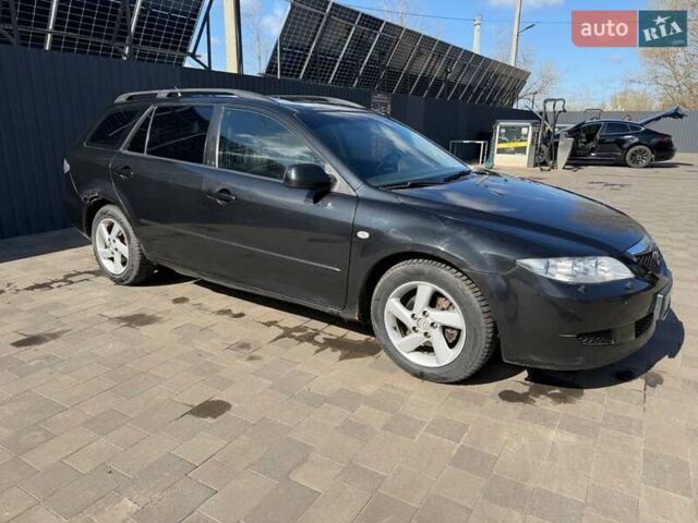 Черный Мазда 6, объемом двигателя 2 л и пробегом 475 тыс. км за 1800 $, фото 1 на Automoto.ua