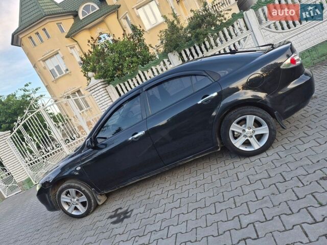 Черный Мазда 6, объемом двигателя 2 л и пробегом 200 тыс. км за 2700 $, фото 1 на Automoto.ua
