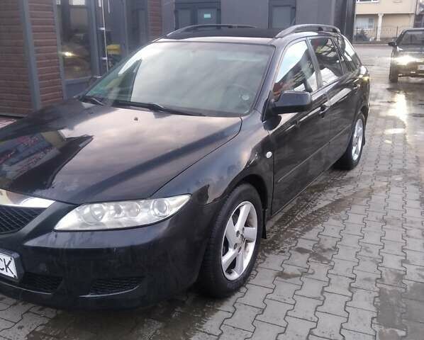 Черный Мазда 6, объемом двигателя 2 л и пробегом 250 тыс. км за 3800 $, фото 1 на Automoto.ua