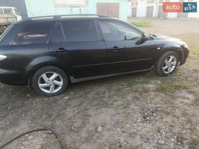 Черный Мазда 6, объемом двигателя 2 л и пробегом 280 тыс. км за 1700 $, фото 1 на Automoto.ua