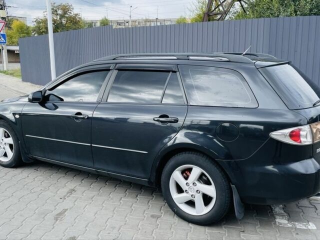 Черный Мазда 6, объемом двигателя 2 л и пробегом 330 тыс. км за 4750 $, фото 1 на Automoto.ua