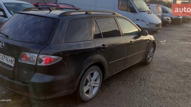 Черный Мазда 6, объемом двигателя 2 л и пробегом 290 тыс. км за 4600 $, фото 1 на Automoto.ua