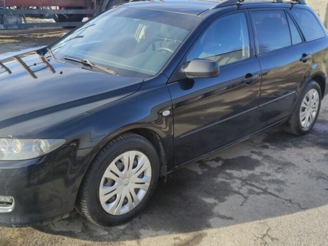 Черный Мазда 6, объемом двигателя 2 л и пробегом 284 тыс. км за 5500 $, фото 1 на Automoto.ua
