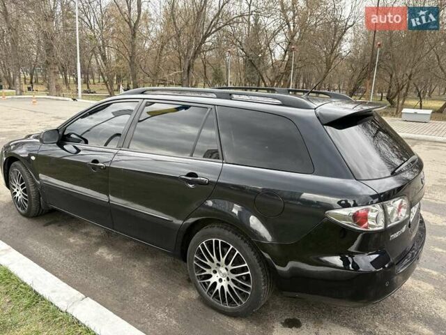 Черный Мазда 6, объемом двигателя 2 л и пробегом 262 тыс. км за 5300 $, фото 1 на Automoto.ua