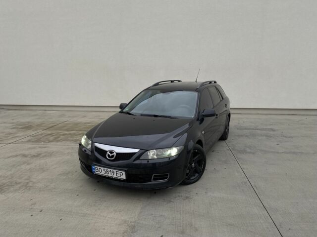 Черный Мазда 6, объемом двигателя 2 л и пробегом 345 тыс. км за 3450 $, фото 1 на Automoto.ua