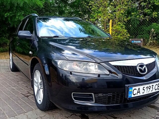 Черный Мазда 6, объемом двигателя 2 л и пробегом 325 тыс. км за 5800 $, фото 1 на Automoto.ua