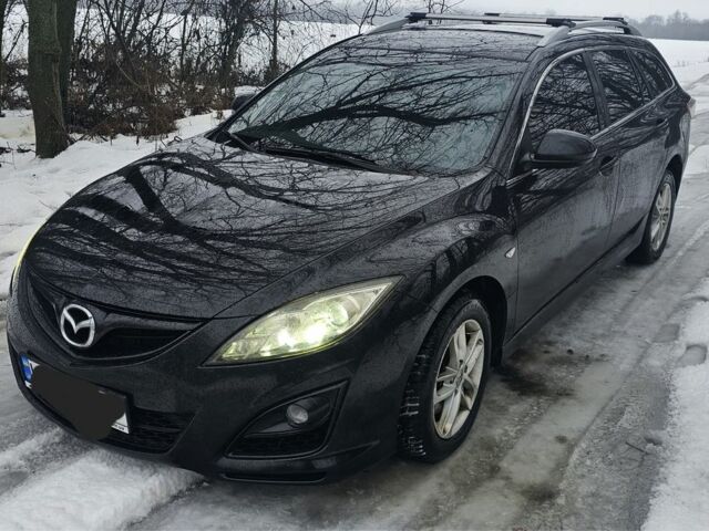 Черный Мазда 6, объемом двигателя 2.2 л и пробегом 250 тыс. км за 6500 $, фото 1 на Automoto.ua