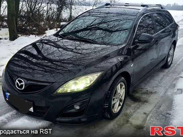 Черный Мазда 6, объемом двигателя 2.2 л и пробегом 250 тыс. км за 6500 $, фото 1 на Automoto.ua