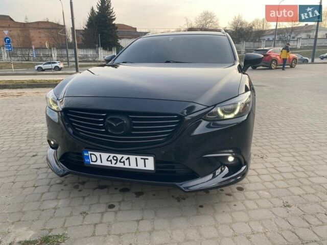 Черный Мазда 6, объемом двигателя 2.19 л и пробегом 246 тыс. км за 14000 $, фото 1 на Automoto.ua