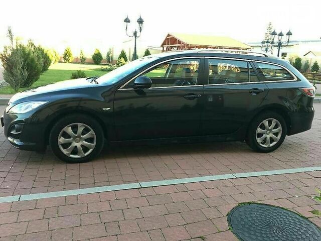 Черный Мазда 6, объемом двигателя 2.2 л и пробегом 112 тыс. км за 10000 $, фото 1 на Automoto.ua