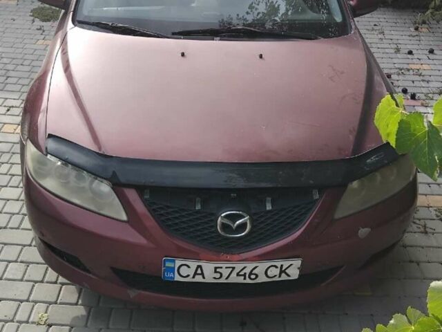 Красный Мазда 6, объемом двигателя 2 л и пробегом 230 тыс. км за 2700 $, фото 1 на Automoto.ua