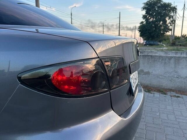 Серый Мазда 6, объемом двигателя 2 л и пробегом 295 тыс. км за 3600 $, фото 1 на Automoto.ua