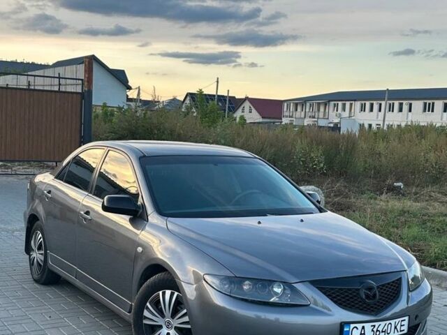 Сірий Мазда 6, об'ємом двигуна 2 л та пробігом 295 тис. км за 3599 $, фото 1 на Automoto.ua