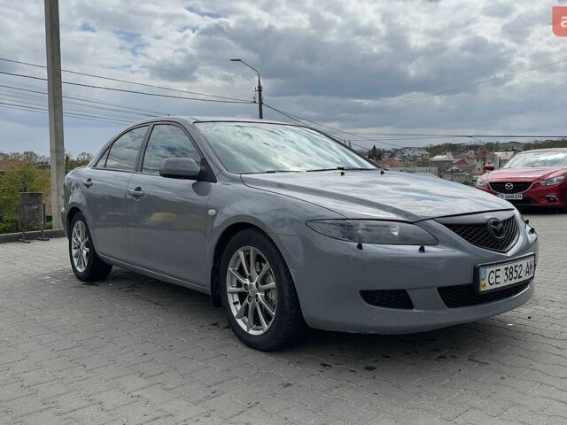 Серый Мазда 6, объемом двигателя 2.3 л и пробегом 426 тыс. км за 3250 $, фото 1 на Automoto.ua