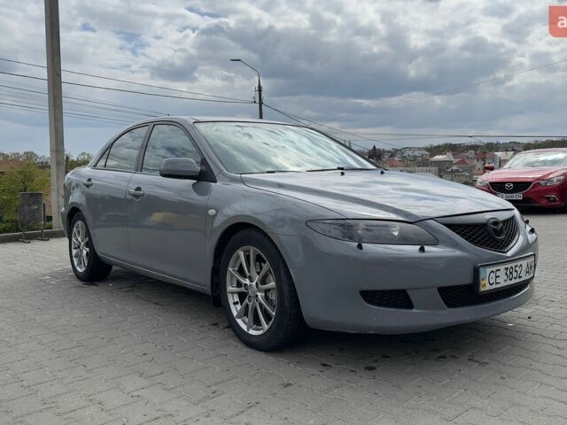 Серый Мазда 6, объемом двигателя 2.3 л и пробегом 426 тыс. км за 3250 $, фото 1 на Automoto.ua