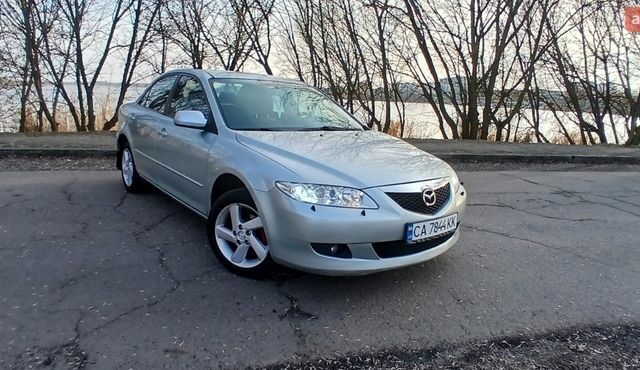 Серый Мазда 6, объемом двигателя 2 л и пробегом 320 тыс. км за 4600 $, фото 1 на Automoto.ua