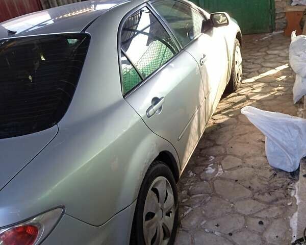 Серый Мазда 6, объемом двигателя 1.8 л и пробегом 290 тыс. км за 3200 $, фото 1 на Automoto.ua