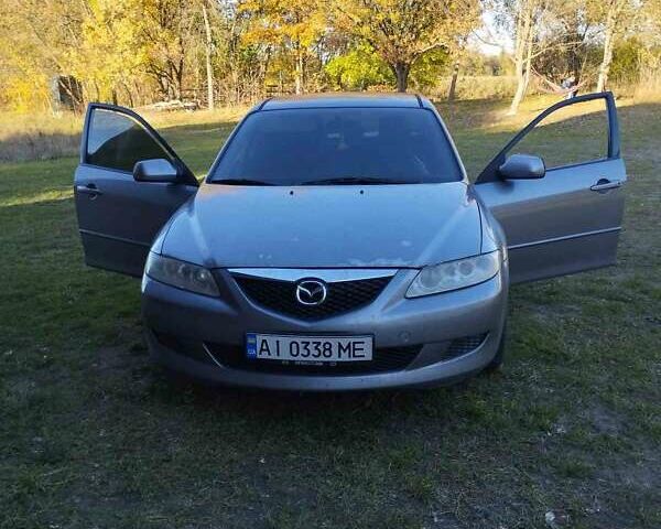 Серый Мазда 6, объемом двигателя 1.8 л и пробегом 295 тыс. км за 4500 $, фото 1 на Automoto.ua