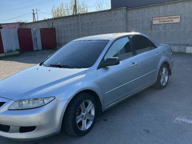 Серый Мазда 6, объемом двигателя 2 л и пробегом 265 тыс. км за 2310 $, фото 1 на Automoto.ua