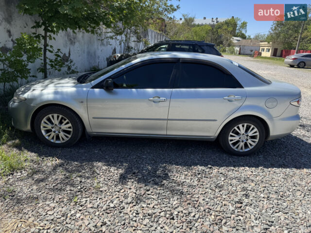 Серый Мазда 6, объемом двигателя 2 л и пробегом 274 тыс. км за 4600 $, фото 1 на Automoto.ua