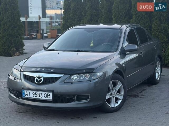 Серый Мазда 6, объемом двигателя 2 л и пробегом 243 тыс. км за 5300 $, фото 1 на Automoto.ua