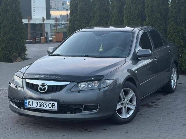 Серый Мазда 6, объемом двигателя 2 л и пробегом 243 тыс. км за 4050 $, фото 1 на Automoto.ua