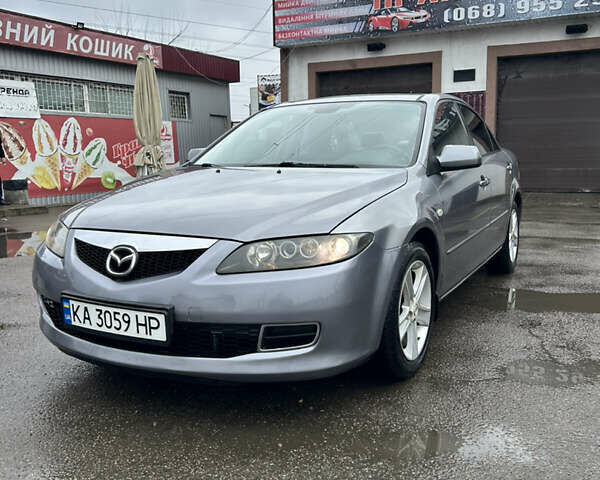 Серый Мазда 6, объемом двигателя 2 л и пробегом 233 тыс. км за 4200 $, фото 1 на Automoto.ua