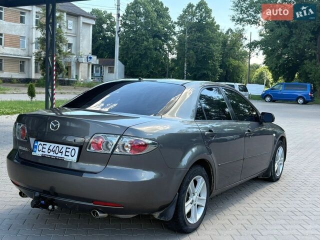 Серый Мазда 6, объемом двигателя 2 л и пробегом 246 тыс. км за 4500 $, фото 1 на Automoto.ua