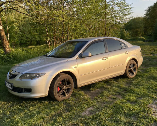 Серый Мазда 6, объемом двигателя 2 л и пробегом 244 тыс. км за 6000 $, фото 1 на Automoto.ua
