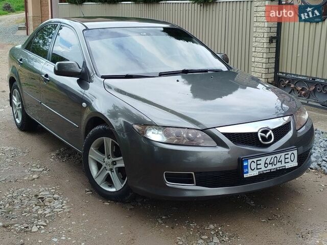 Серый Мазда 6, объемом двигателя 2 л и пробегом 246 тыс. км за 3700 $, фото 1 на Automoto.ua