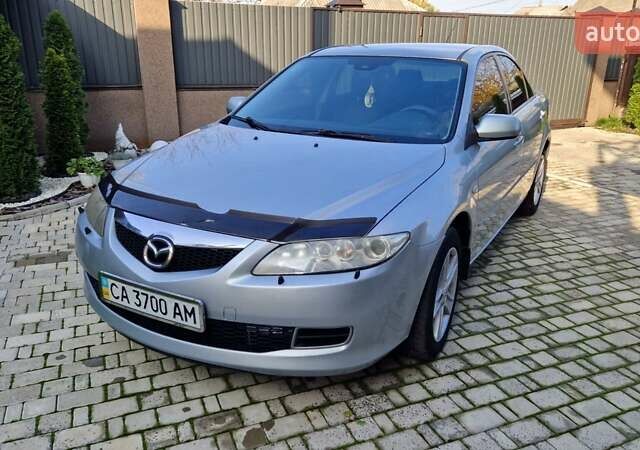 Сірий Мазда 6, об'ємом двигуна 1.8 л та пробігом 253 тис. км за 5400 $, фото 1 на Automoto.ua