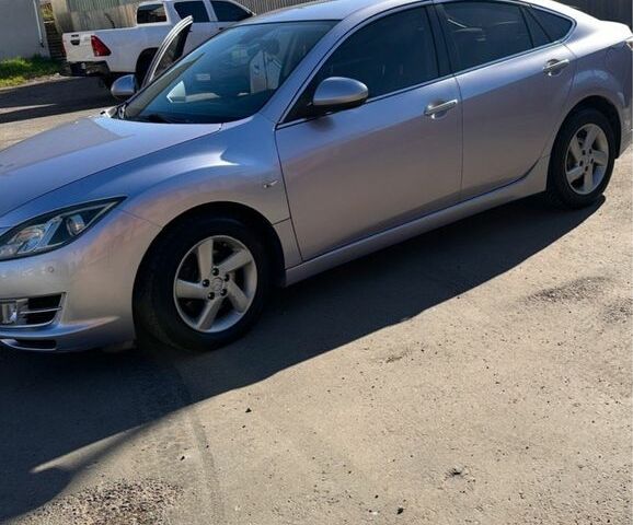 Серый Мазда 6, объемом двигателя 2 л и пробегом 230 тыс. км за 6700 $, фото 1 на Automoto.ua