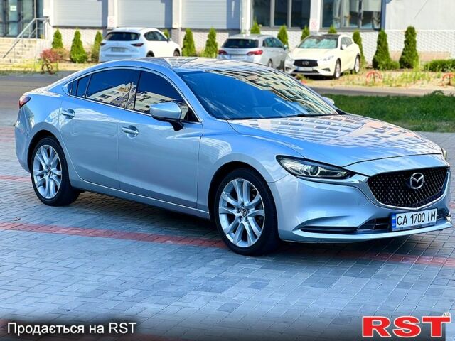 Серый Мазда 6, объемом двигателя 2.5 л и пробегом 106 тыс. км за 15499 $, фото 1 на Automoto.ua