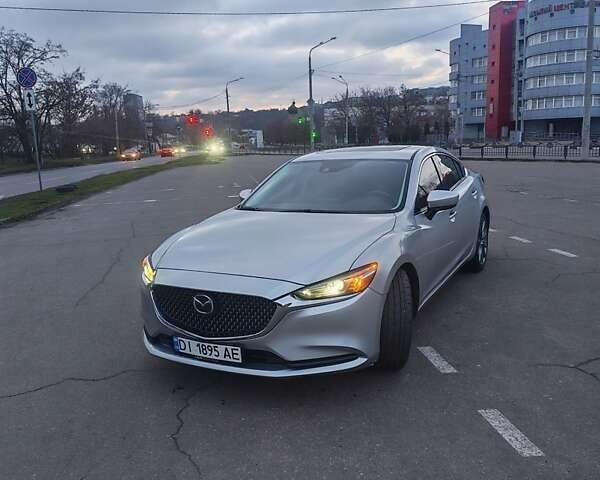 Серый Мазда 6, объемом двигателя 2.49 л и пробегом 123 тыс. км за 18000 $, фото 1 на Automoto.ua