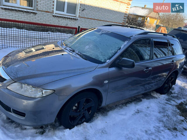 Серый Мазда 6, объемом двигателя 2 л и пробегом 319 тыс. км за 4200 $, фото 1 на Automoto.ua