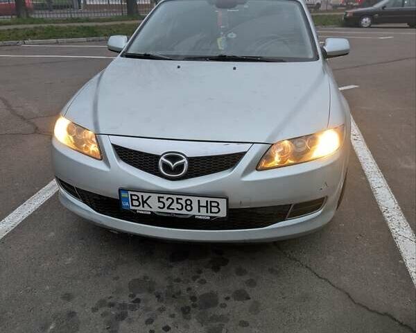Серый Мазда 6, объемом двигателя 2 л и пробегом 234 тыс. км за 4600 $, фото 1 на Automoto.ua
