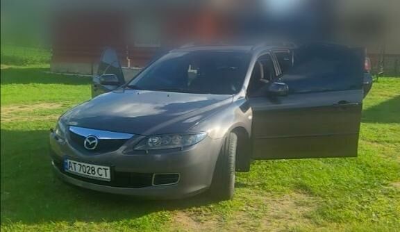 Серый Мазда 6, объемом двигателя 2 л и пробегом 275 тыс. км за 6100 $, фото 1 на Automoto.ua