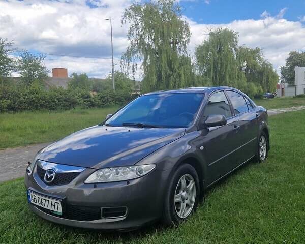 Серый Мазда 6, объемом двигателя 2 л и пробегом 231 тыс. км за 5600 $, фото 1 на Automoto.ua