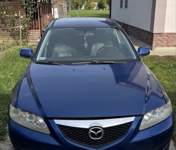Синий Мазда 6, объемом двигателя 2 л и пробегом 320 тыс. км за 891 $, фото 1 на Automoto.ua