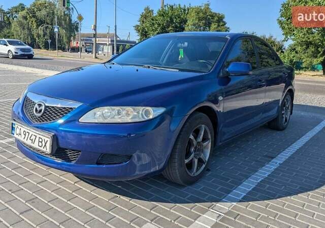 Синий Мазда 6, объемом двигателя 1.8 л и пробегом 323 тыс. км за 3900 $, фото 1 на Automoto.ua
