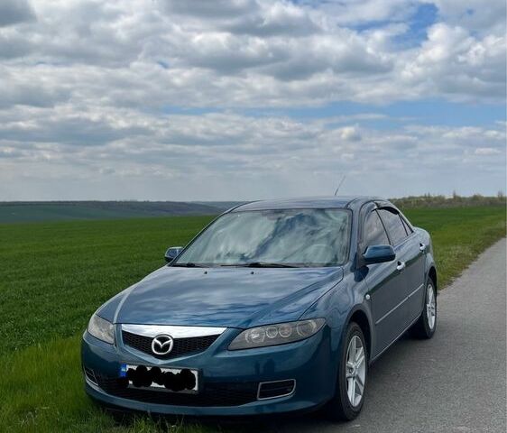 Синий Мазда 6, объемом двигателя 1.8 л и пробегом 250 тыс. км за 4444 $, фото 1 на Automoto.ua