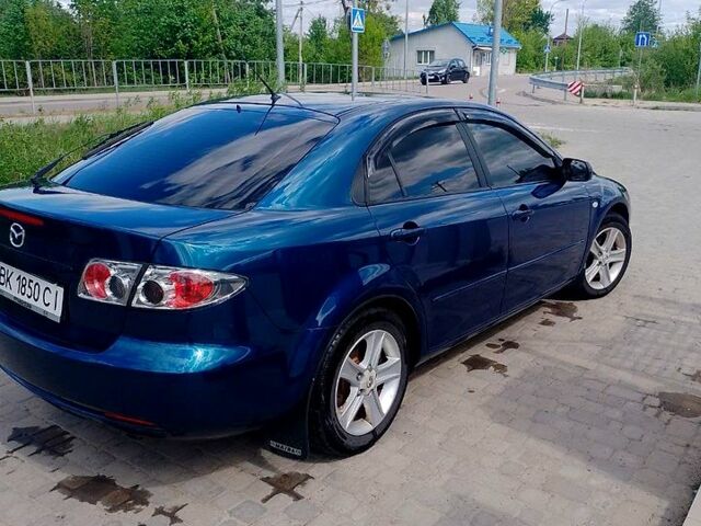 Синий Мазда 6, объемом двигателя 2 л и пробегом 234 тыс. км за 4300 $, фото 1 на Automoto.ua