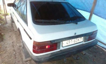 Белый Мазда 626, объемом двигателя 2 л и пробегом 999 тыс. км за 1300 $, фото 1 на Automoto.ua