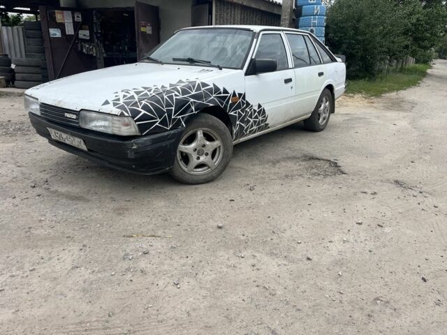 Белый Мазда 626, объемом двигателя 2 л и пробегом 300 тыс. км за 852 $, фото 1 на Automoto.ua