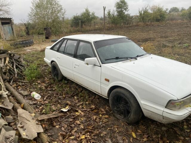 Белый Мазда 626, объемом двигателя 2 л и пробегом 464 тыс. км за 699 $, фото 1 на Automoto.ua