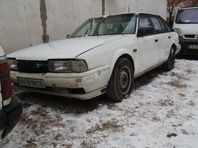 Белый Мазда 626, объемом двигателя 2 л и пробегом 350 тыс. км за 356 $, фото 1 на Automoto.ua