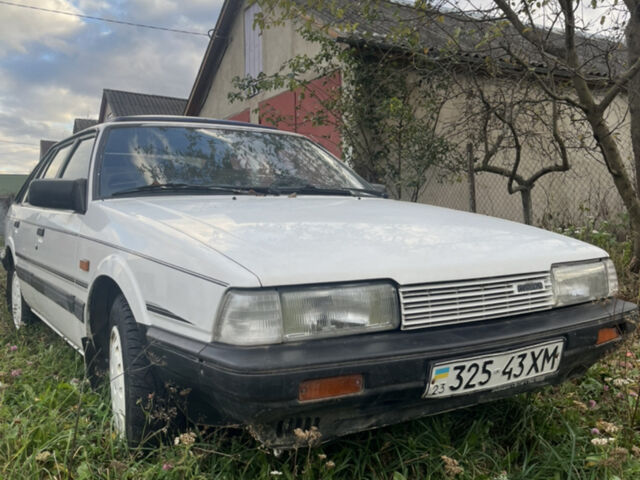 Белый Мазда 626, объемом двигателя 2 л и пробегом 240 тыс. км за 1100 $, фото 1 на Automoto.ua