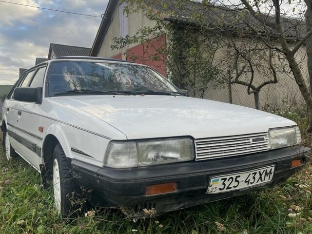 Белый Мазда 626, объемом двигателя 2 л и пробегом 240 тыс. км за 1300 $, фото 1 на Automoto.ua