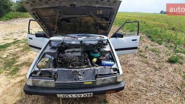 Белый Мазда 626, объемом двигателя 2 л и пробегом 200 тыс. км за 1500 $, фото 1 на Automoto.ua