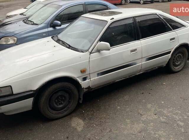 Белый Мазда 626, объемом двигателя 2 л и пробегом 400 тыс. км за 600 $, фото 1 на Automoto.ua